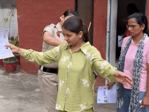 Police personnel check with metal detector in Hisar.