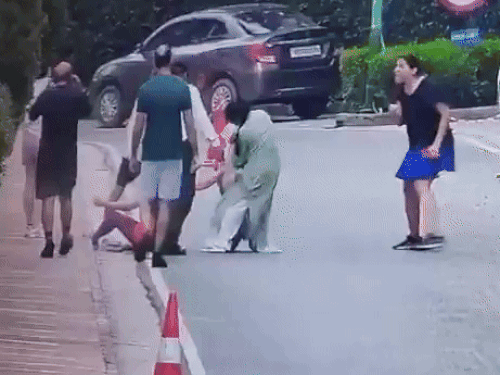After hard work, the dog was removed from the woman. Meanwhile, another woman standing there was also seen escaping from the dog.