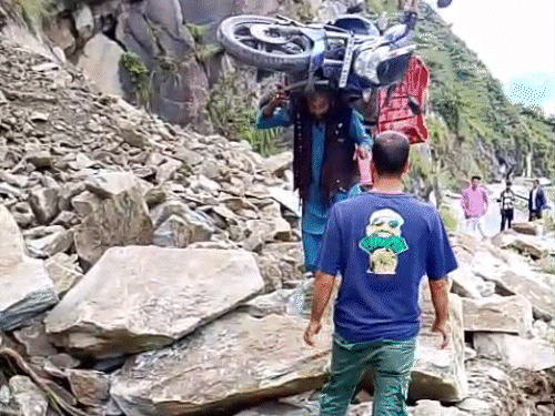 Youth picked up a bike on his shoulder in Churah of Chamba