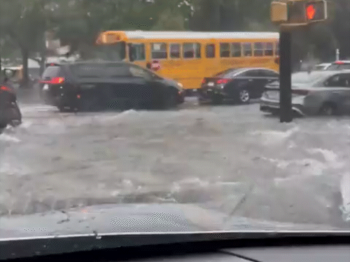 Many vehicles including school bus were stuck due to water filling on the roads in New York. Due to which the Clearview Expressway had to be closed.