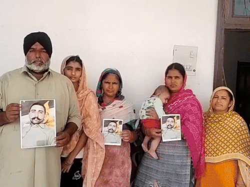 Amritpal Singh's father Jagraj Singh and the people of the village showing his picture.