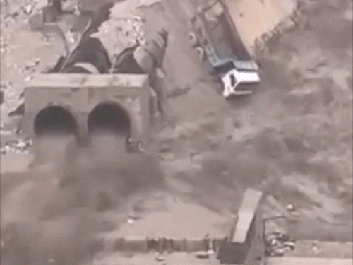 Machinery engaged in construction of Malana project after heavy rains