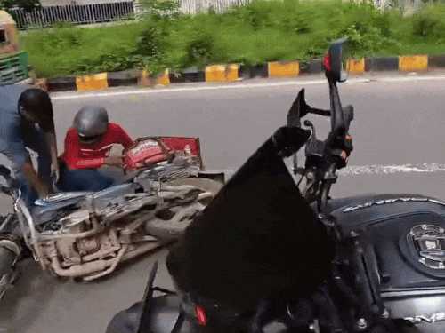 Food delivery bike rider fell on the road due to collision.