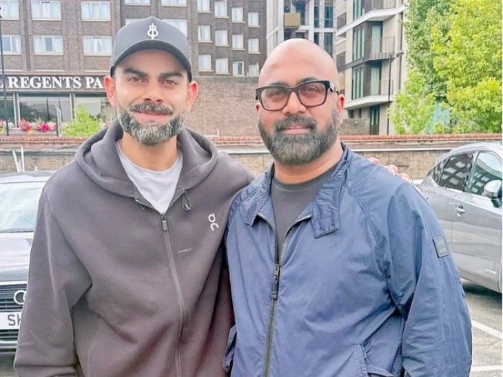 A recent picture of Virat Kohli is going viral on the Internet. In it, he is seen standing with a person. Most of his beard hair looks white. In such a situation, the fans are saying- 'Kohli became old.' - Dainik Bhaskar