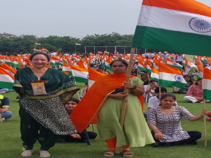 Warden Sunita Malhan standing with the tricolor before the tricolor journey begins.