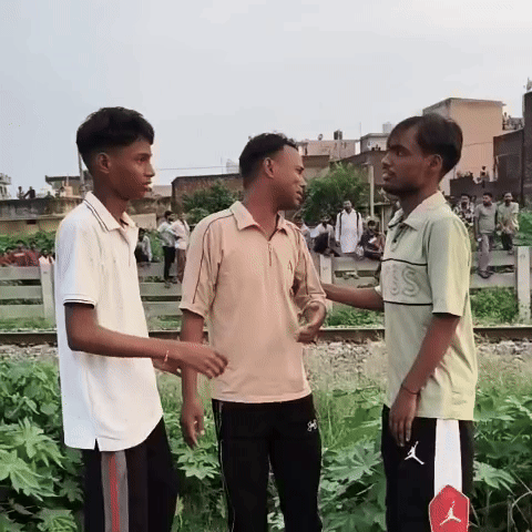Brother mourning the sister's body on the railway track.