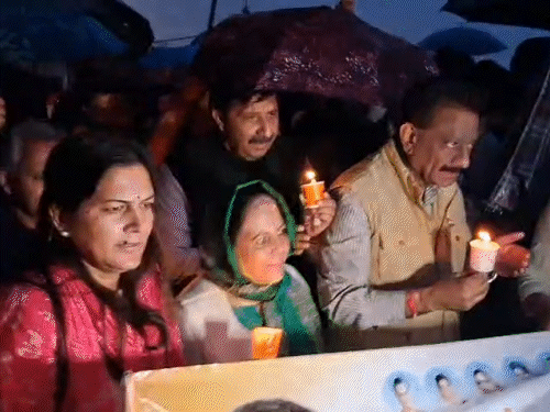 Congress holding a candle march on Mall Road in Shimla