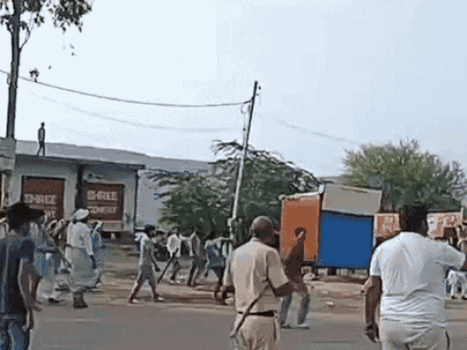 This video is also from August 12. The shops were burnt in it. People are also seen pelting stones, while a policeman is seen as a mute spectator with a stick in his hand.