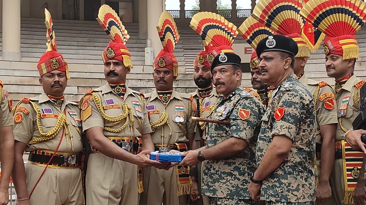 Commandant giving sweets to the soldiers.