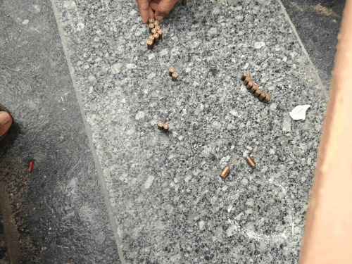 पुलिस को घर के बाहर गोलियों के कारतूस मिले।