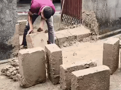 Stones being installed to prevent water from entering the house.
