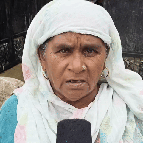 Krishna Devi giving information about the damage caused by flood water.