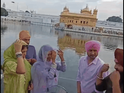 Harbhajan Singh wife Geeta Basra with folded hands in Golden Temple.