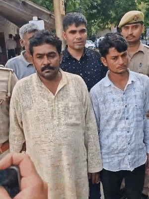 The police arrested former head Sanjay Patel (in the kurta) and his nephew Sandeep Patel.