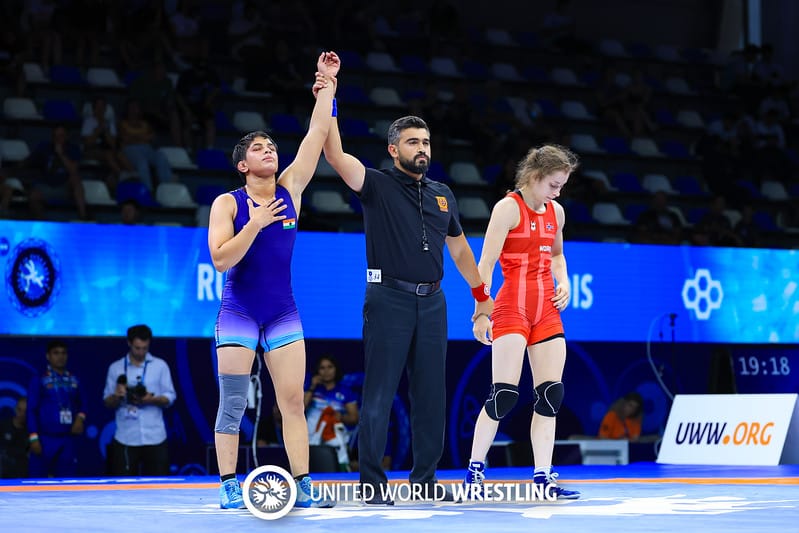 Referee raised austerity after winning gold at the World Junior Championship.
