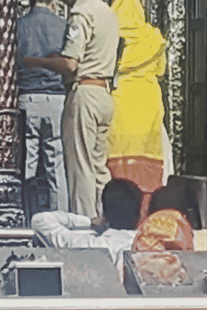 Police personnel roaming around with rifle in Banke Bihari temple.