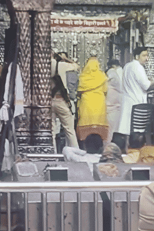 Police personnel take photographs for AK-47 on shoulder in Jagmohan.