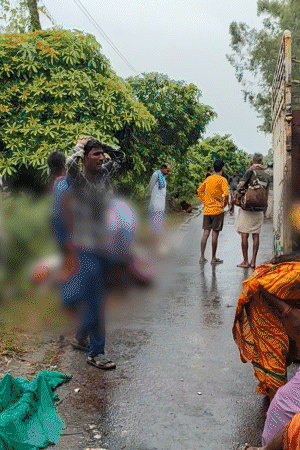 Family weeping near the corpse lying on the road after the accident.