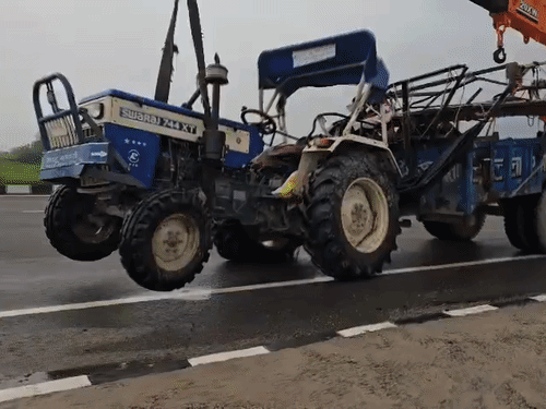 After the accident, the tractor trolley was removed from the road after the crane.