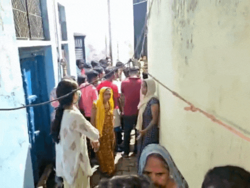 There is a crowd of people from the locality outside Arjun Kumar's house.