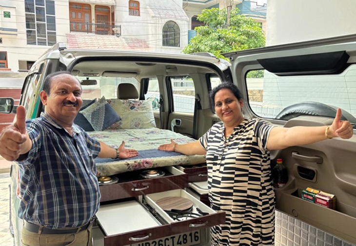 Suresh Kumar Arora showing a car setup with his wife Shabnam Arora.