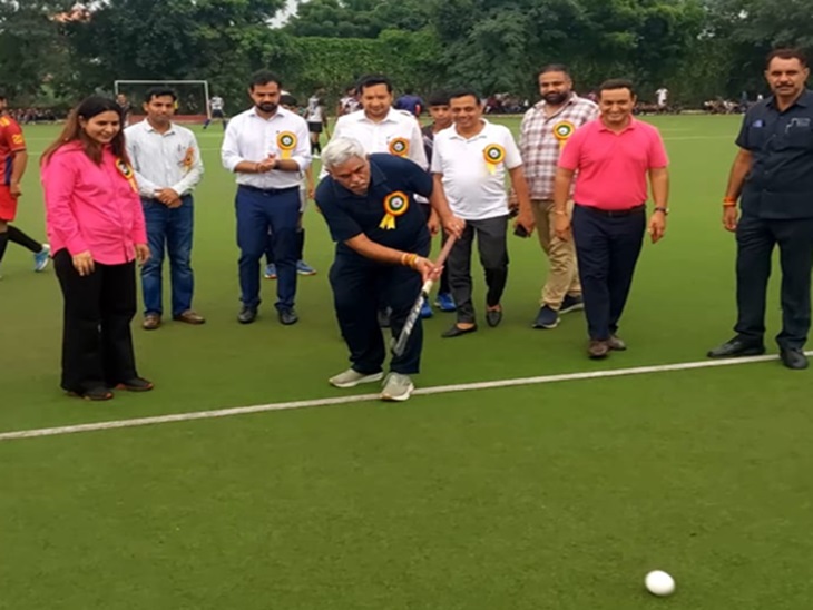 Former minister Manish Grover launching hockey game.