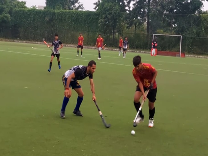 Players playing hockey.