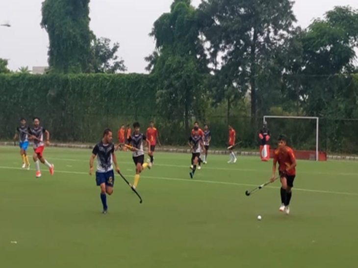 Players playing hockey.