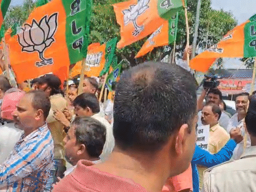 BJP workers gathered outside the Congress office in Patna.