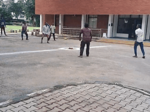 Employees playing volleyball.