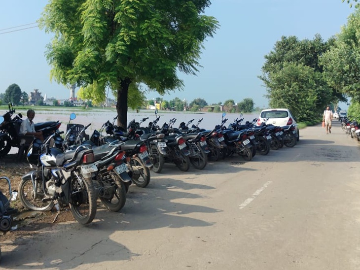 Vehicles stood outside the village for emergency.
