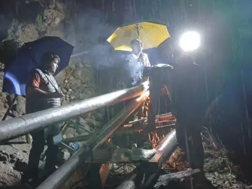 Employees of the Water Power Department engaged in restoration of water in Kullu late at night.