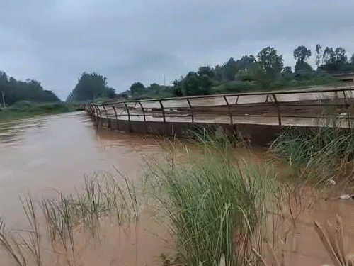 The water of the Markanda River flowing equal to the bridge in Kurukshetra.