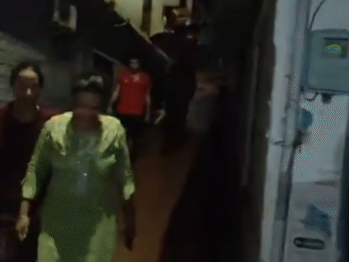 People leaving the houses after falling stones at night along the Paddal ground in Mandi.