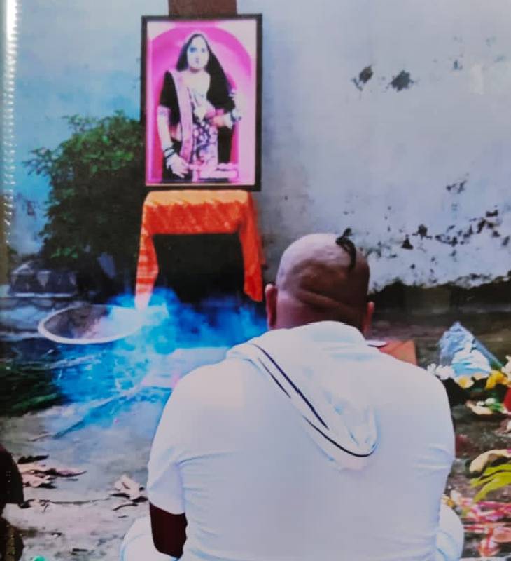 In this footage, Uday was sitting in front of his wife's picture and crying for a long time.
