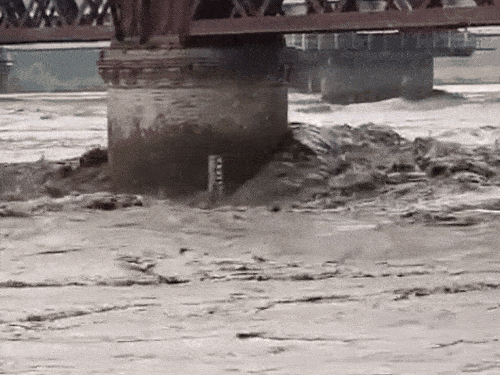 Yamuna water passing under the old bridge located in Kalanaur.