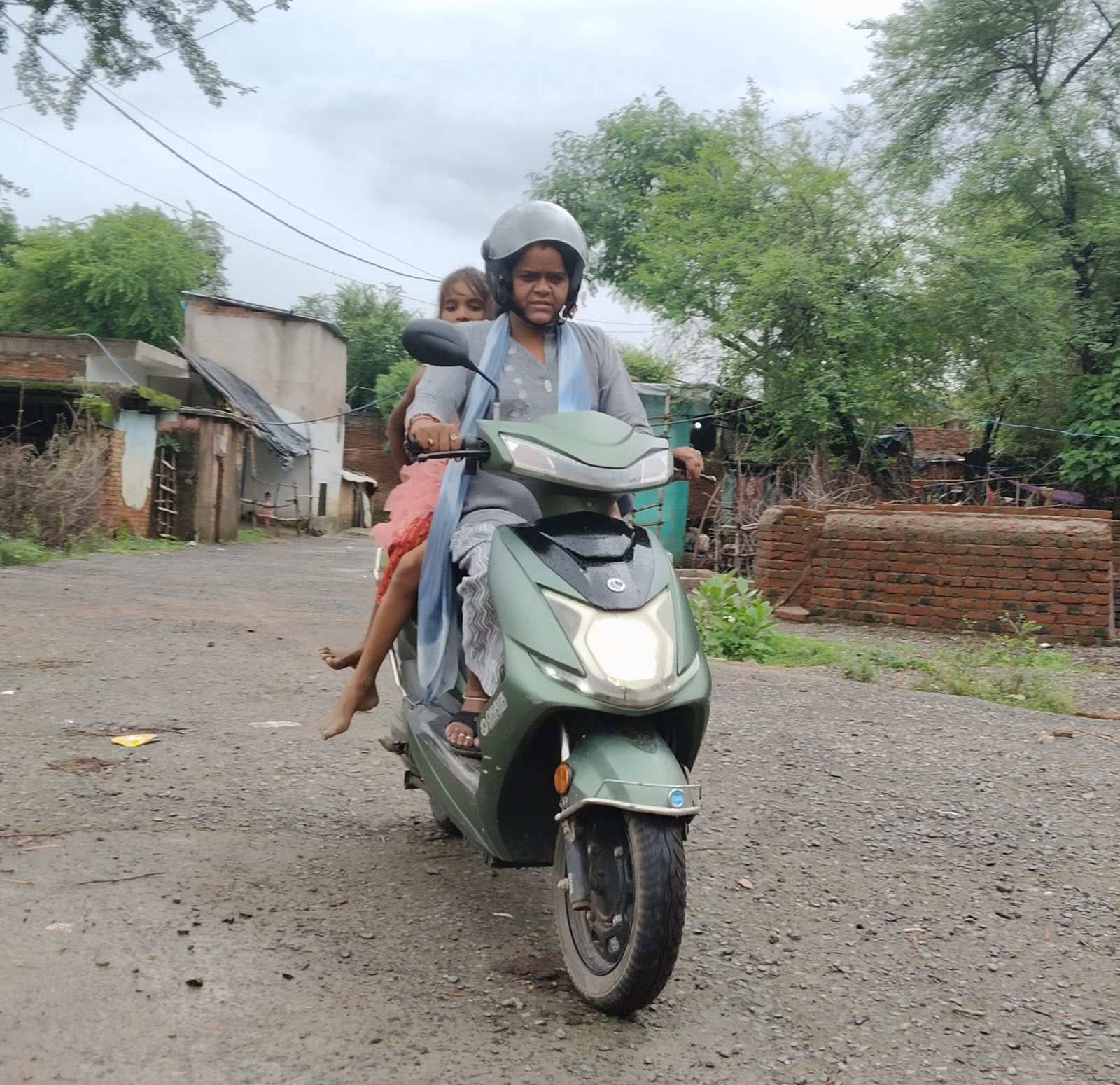 When a child does not come to school, teacher Sheela Patel arrives at her home scooty to pick her up.
