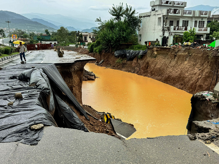 Jammu-Srinagar National Highway collapsed due to rain in Udhampur, Jammu and Kashmir on Wednesday.