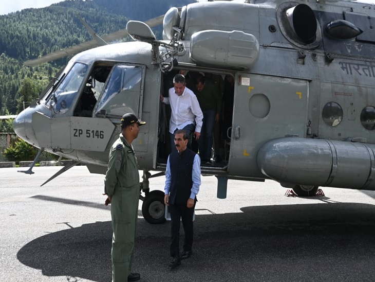 Chief Minister Sukhwinder Sukhu descending from the helicopter in Kullu.