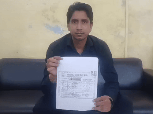 Pitam Singh shows the document of marriage in Arya Samaj temple.