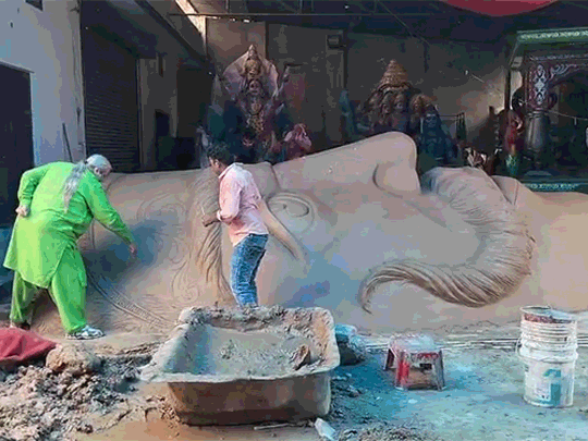 Artisan Tajendra making a huge effigy of Ravana.