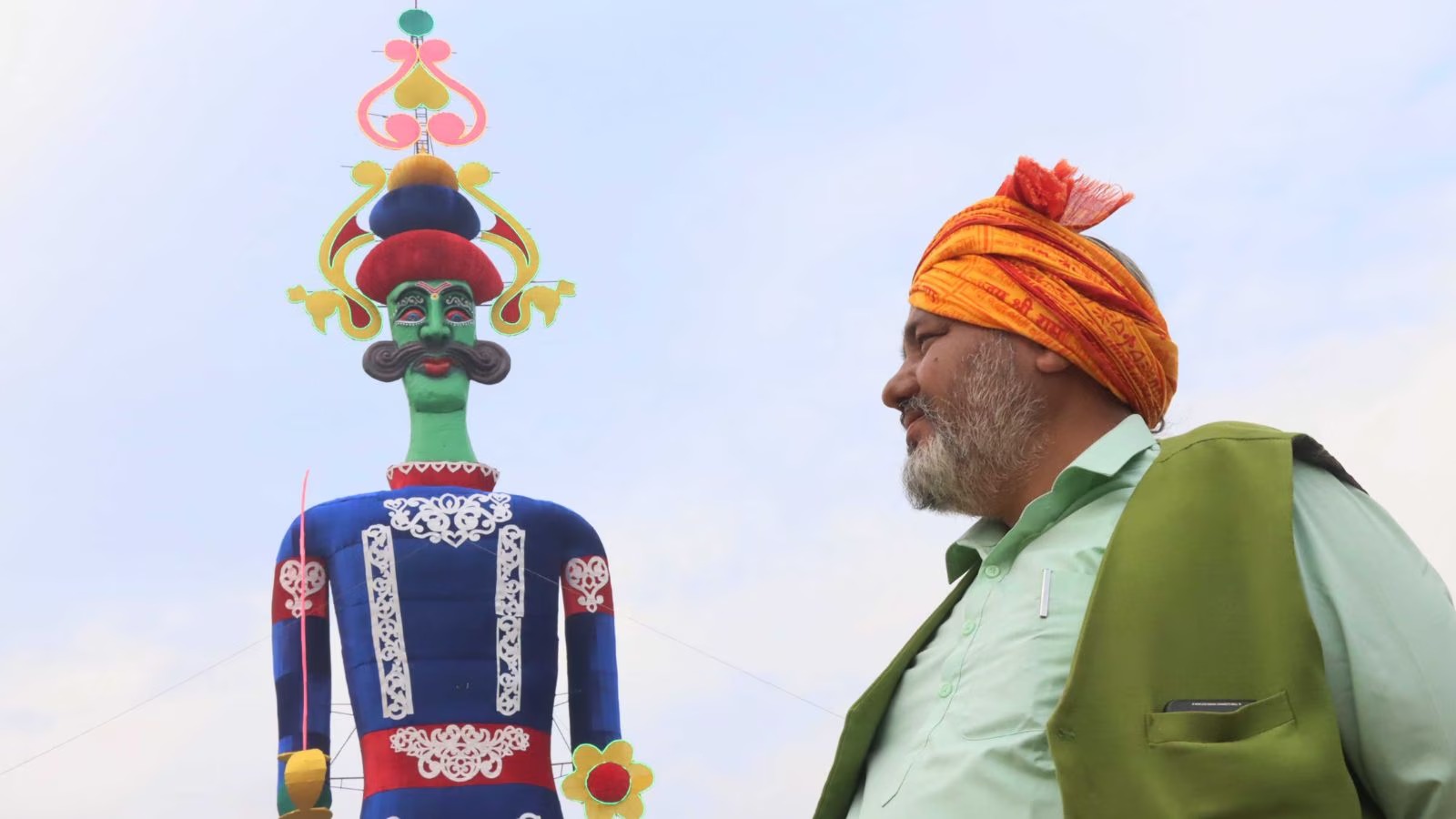 Tajendra standing with the effigy of Ravana.