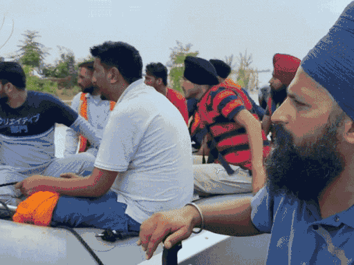 Social organizations are going from house to house in a boat in Sultanpur Lodhi area.