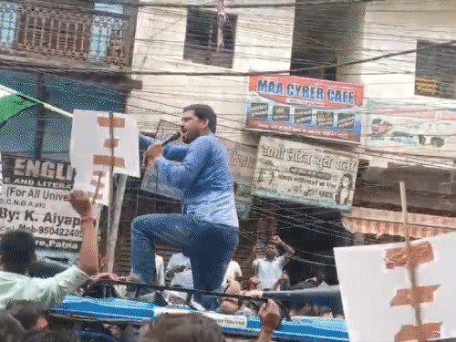 Student leader Dilip performing with the tricolor.