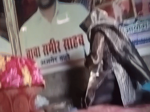 Sameer Baba burnt incense sticks in front of her picture with the female reporter.