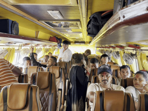 People sitting in a bus to go to Nepal from Hisar.