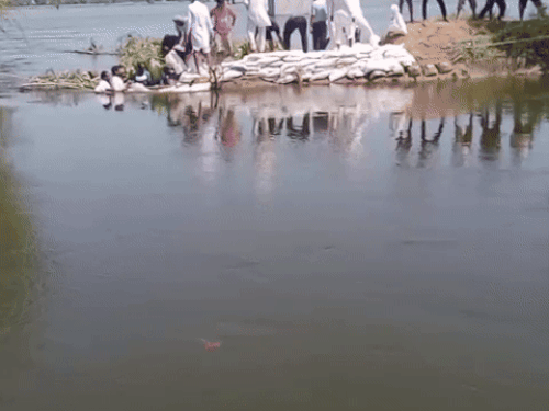 Villagers tied up after breaking the ghaggar drain in Sugar Mandori village