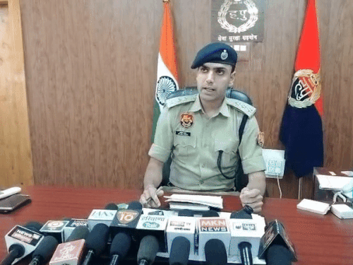 Nuh ASP Ayush Yadav giving information.