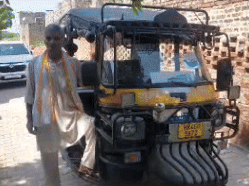 Meenakshi's father Sri Krishna Hooda with his auto.