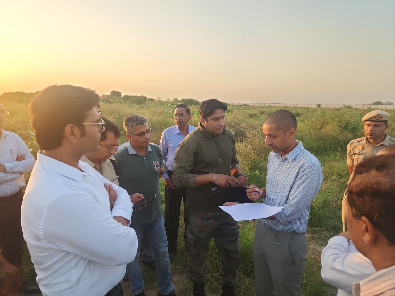 DC interacting with army officers regarding the aircraft at Hisar Airport.